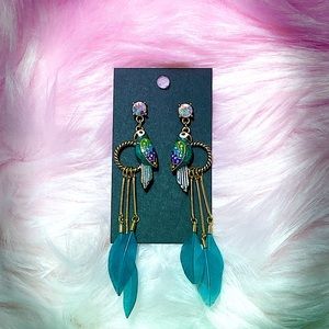 Parrot dangle earrings. Might be Betsey Johnson’s.